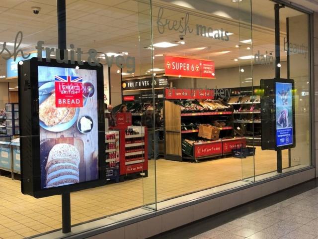 SpacePole Universal Indoor Enclosures installed in Aldi store window